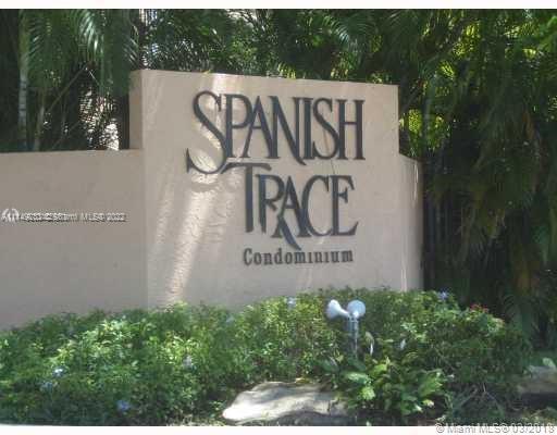 Entrance sign for Spanish Trace Condominium.