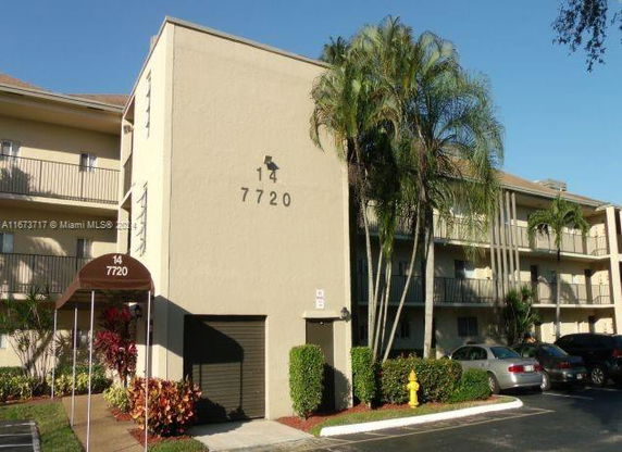 Front view of a multi-story building with balconies.