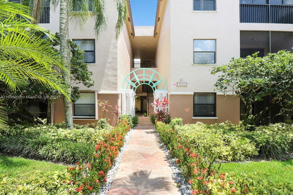 Front view of a multi-story building with a decorative entrance.