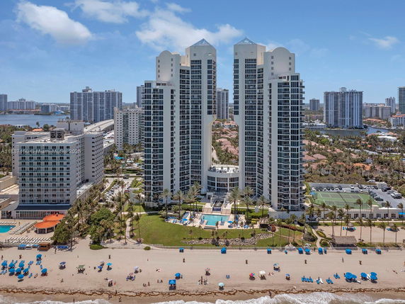 Overview of a beachfront high-rise building complex surrounded by other tall buildings.