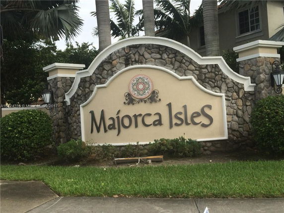 Front view of a stone entrance sign for Majorca Isles.
