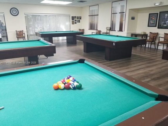 Room with billiard tables and chairs