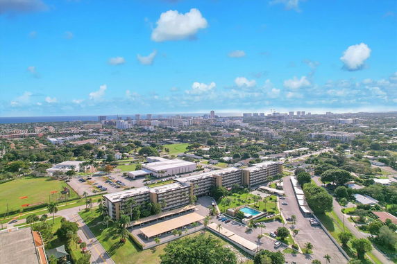 Panoramic view of a cityscape with multiple low-rise and mid-rise buildings.