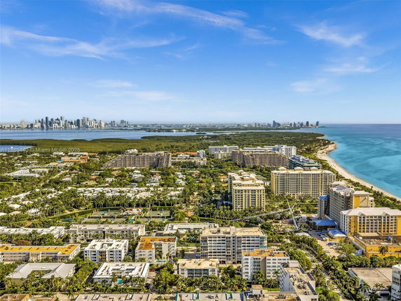 Panoramic view of a city with high-rise buildings near the coastline.