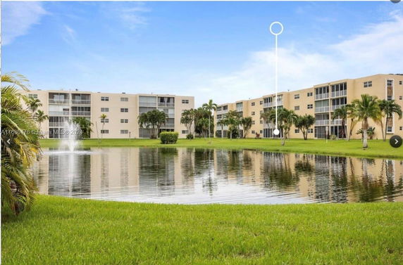 Front view of multi-story apartment buildings with balconies.