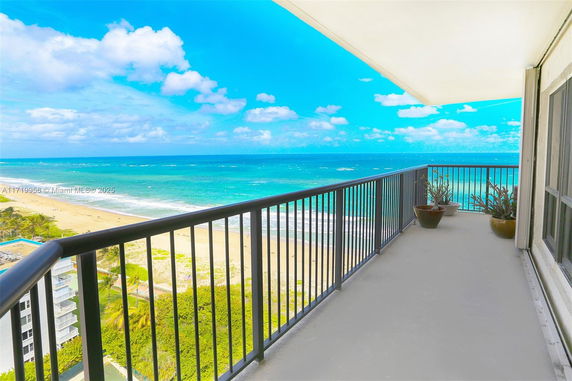 Balcony view overlooking the ocean and beach.