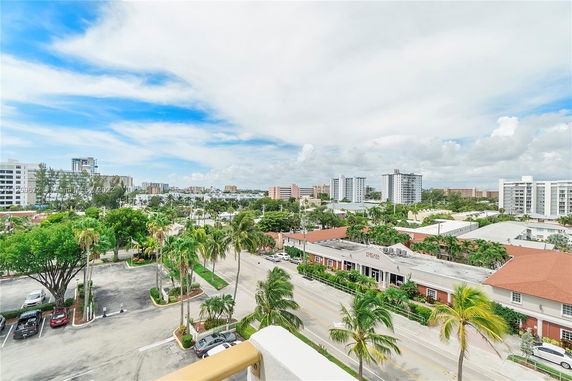 Panoramic view of urban area with residential buildings and greenery.