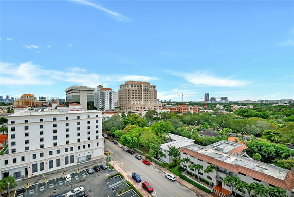 Panoramic view of buildings and natural surroundings.