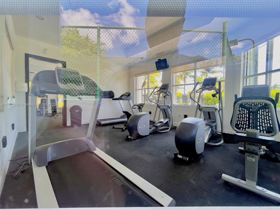 Interior of a fitness room with exercise equipment.