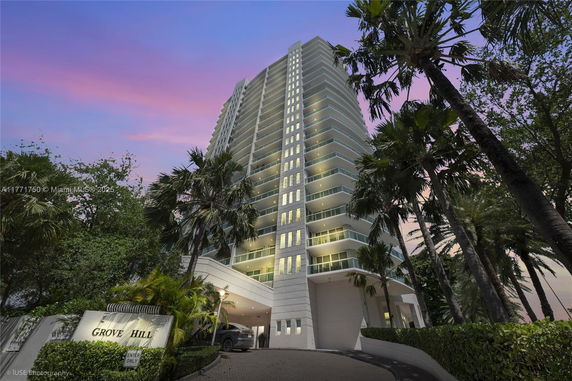 Front view of a high-rise building with a prominent entrance.