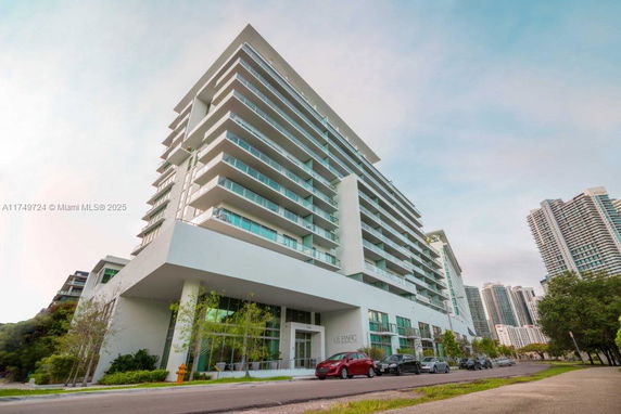 Front view of a multi-story modern apartment building.