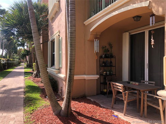 Front view of a house with a small patio space.