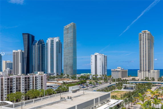 View of tall modern skyscrapers near the coastline.