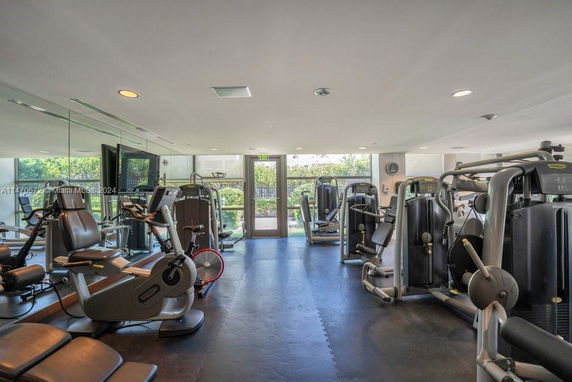 Indoor gym area with various exercise equipment.