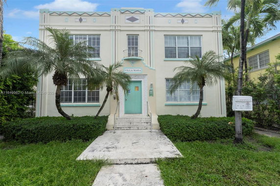 Front view of a two-story building with symmetrical windows and a central entrance.