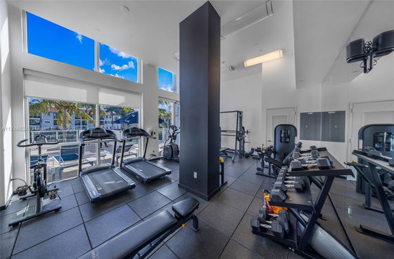 Interior of a modern gym with exercise equipment.