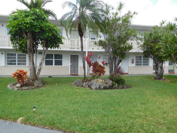 Front view of a two-story residential building with balconies.