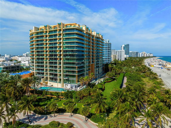 Front view of a high-rise building with a beachside location.