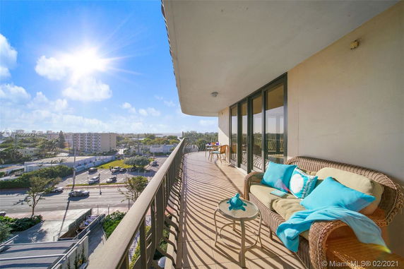 Balcony view overlooking surrounding cityscape from a high-rise building.