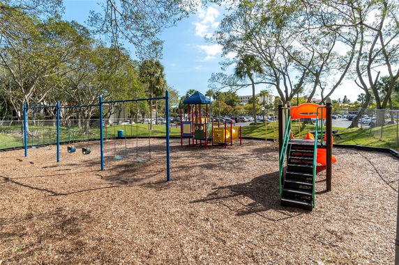 Playground with swings and a climbing structure.
