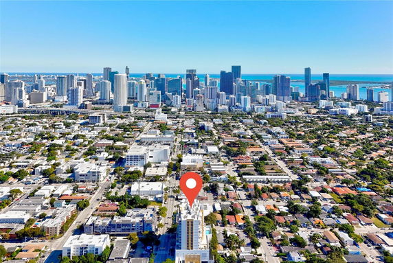 Panoramic view of a city with tall buildings and a highlighted location.