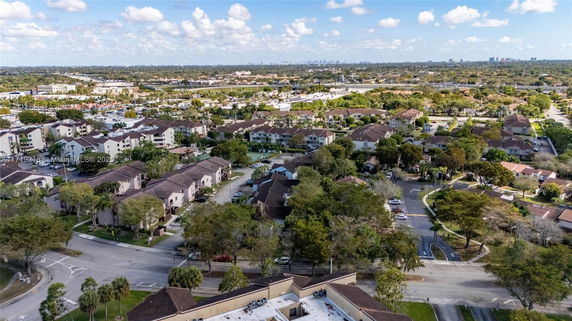 Aerial view of a suburban neighborhood with multiple residential buildings and roads.