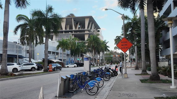 Front view of a modern multi-story building with unique architectural design.