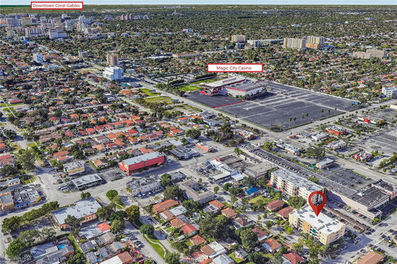 Aerial view of an urban area with numerous residential buildings and landmarks highlighted, including a casino and downtown area.