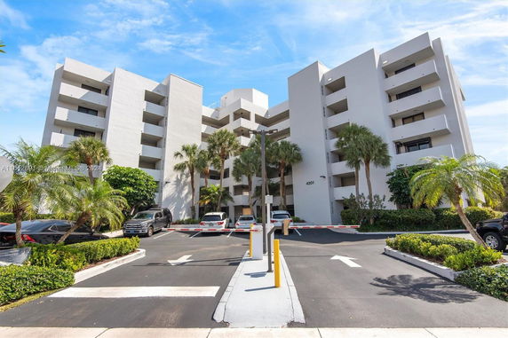 Front view of a multi-story building with balconies.
