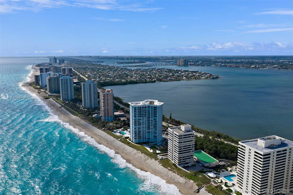 Panoramic view of multiple beachfront high-rise buildings overlooking the ocean.
