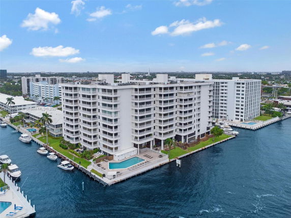Front view of a multi-story waterfront condominium building.