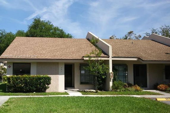 Front view of a single-story house with a triangular roof.
