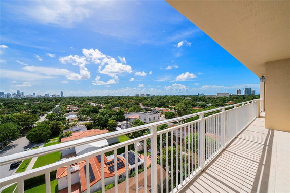 Panoramic view from a high balcony overlooking a cityscape.