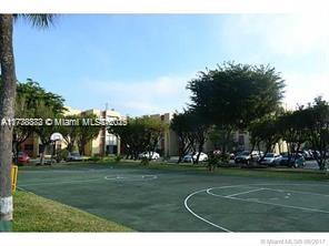 Basketball court in front of residential buildings.