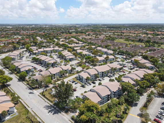 Aerial view of a residential neighborhood with multiple buildings and streets.