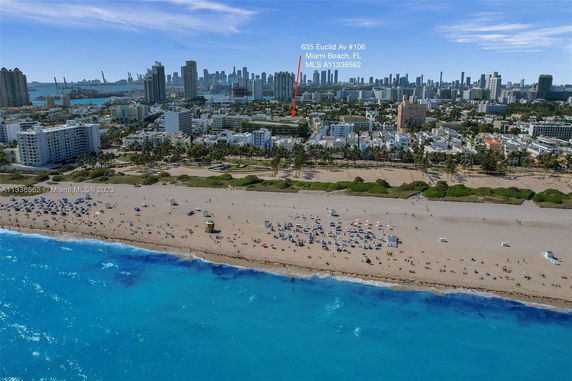 Aerial view of Miami Beach with city skyline in the background.