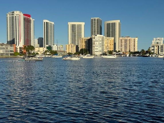 Skyline view of multiple high-rise buildings along the waterfront.
