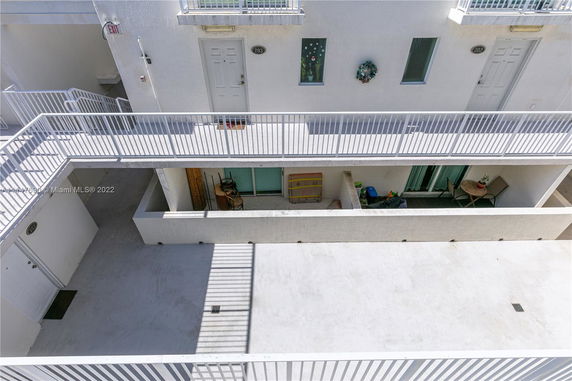 Exterior view of a multi-story apartment building with balconies.