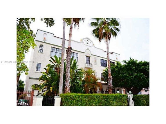 Front view of a multi-story building with decorative architecture.
