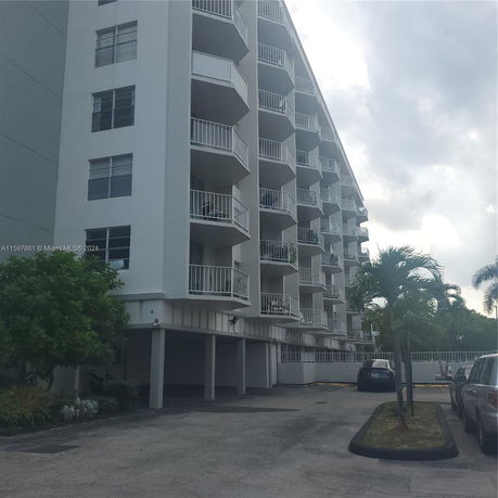 Angled view of a multi-story building with balconies.