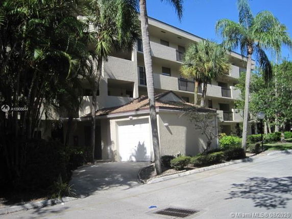 Front view of a multi-story residential building with balconies.