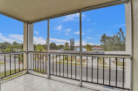 View of surrounding residential area from a building balcony.