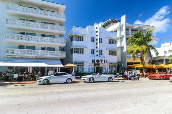 Front view of a hotel building with multiple stories and a distinctive facade.