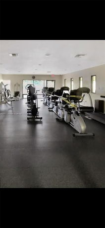 Interior view of a gym with exercise equipment.