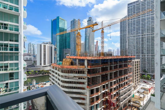 View of high-rise buildings under construction and surrounding skyscrapers.