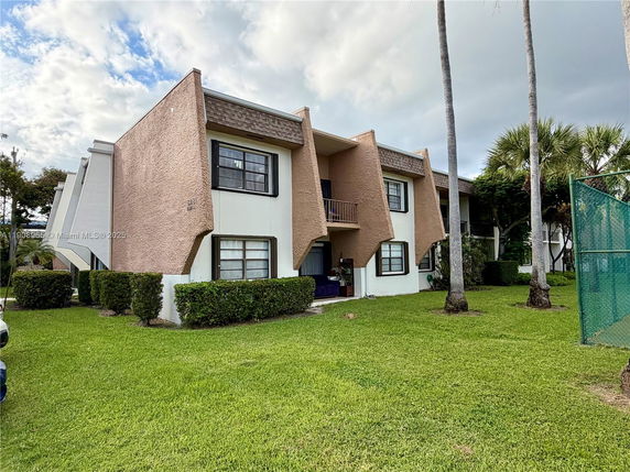 Front view of a two-story residential building with unique architectural design.