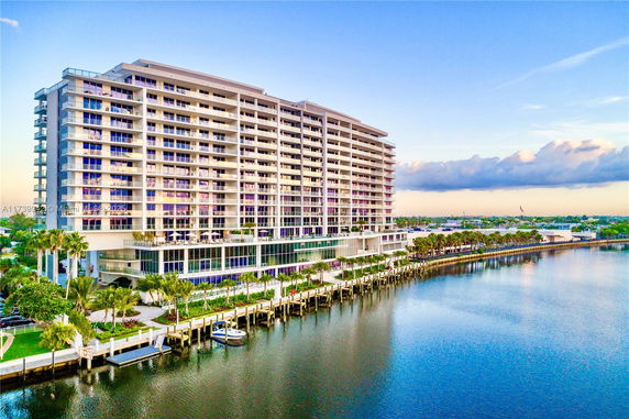Front view of a large multi-story waterfront building.
