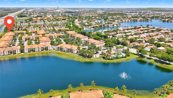 Panoramic view of residential buildings near a lake.