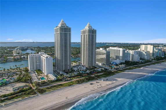 Panoramic view of a beachfront area with high-rise buildings.