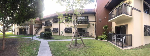 Front view of a two-story residential building with balconies.
